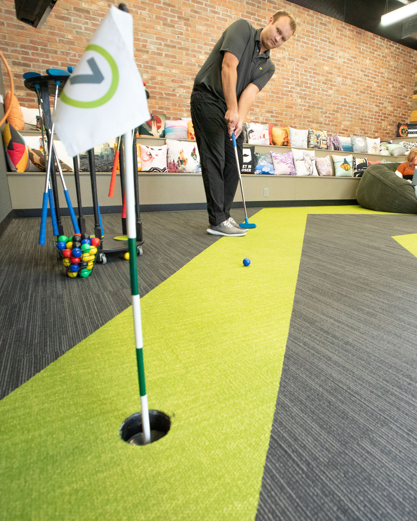Playing mini golf in the Epicosity office. 